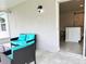 Relaxing outdoor patio with comfortable seating adjacent to the kitchen at 3638 Sw 127Th Lane Rd, Ocala, FL 34473
