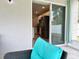 Relaxing patio view with comfortable seating overlooking the kitchen through sliding glass doors at 3638 Sw 127Th Lane Rd, Ocala, FL 34473
