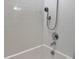 Modern bathroom featuring a shower with white subway tile surround and updated fixtures at 3638 Sw 127Th Lane Rd, Ocala, FL 34473