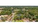 A house surrounded by tall trees, offering a sense of seclusion with a long private driveway at 40050 Darlington Ave, Lady Lake, FL 32159