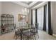 Dining area features a modern chandelier and elegant decor at 40050 Darlington Ave, Lady Lake, FL 32159