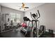Home gym with fitness equipment, including treadmill, elliptical machine, and weightlifting station at 40050 Darlington Ave, Lady Lake, FL 32159