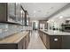 Gourmet kitchen with granite counters, stainless appliances, custom cabinets, and spacious layout at 40050 Darlington Ave, Lady Lake, FL 32159