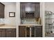 Kitchen area features a wet bar with wine storage at 40050 Darlington Ave, Lady Lake, FL 32159