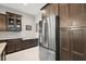 Kitchen boasts stainless steel refrigerator and well-crafted cabinets at 40050 Darlington Ave, Lady Lake, FL 32159