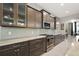 Modern kitchen with sleek stainless steel appliances, custom cabinets, and ample counter space at 40050 Darlington Ave, Lady Lake, FL 32159