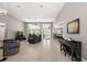Spacious living room with tile floors, high ceilings, large windows, and an open layout at 40050 Darlington Ave, Lady Lake, FL 32159