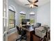 Bright home office with natural light, built-in desk, and modern fixtures at 40050 Darlington Ave, Lady Lake, FL 32159