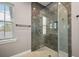 Shower with marble tiling, and a window with blinds at 40050 Darlington Ave, Lady Lake, FL 32159