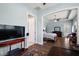 View from the sitting area into the main bedroom; showcases hardwood floors and ceiling fan at 40050 Darlington Ave, Lady Lake, FL 32159