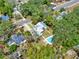 An aerial view shows the property's layout, including the house and a lovely pool in its backyard at 506 Perkins St, Leesburg, FL 34748