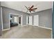 Spacious bedroom with hardwood floors, ample closet space, and neutral paint at 506 Perkins St, Leesburg, FL 34748