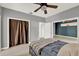 Comfortable bedroom with a closet, light-colored floors, and gray walls at 506 Perkins St, Leesburg, FL 34748