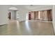 Bright living room with wood floors, an arched doorway, and a red front door at 506 Perkins St, Leesburg, FL 34748