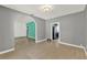 Open-concept living area with sleek floors, neutral paint, and arched doorways at 506 Perkins St, Leesburg, FL 34748