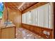 Unique room with wood paneling, colorful tile flooring, and bright lighting at 506 Perkins St, Leesburg, FL 34748