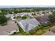 An aerial view of the home showcasing a screened porch, landscaping and neighborhood at 506 Weston Manor Dr, The Villages, FL 32162