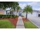 Charming single-story home with well-manicured landscaping and inviting entryway at 506 Weston Manor Dr, The Villages, FL 32162