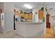 Well-equipped kitchen with stainless steel appliances, ample cabinetry, and a breakfast bar at 506 Weston Manor Dr, The Villages, FL 32162