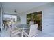 Covered patio offering a comfortable seating area and a seamless transition to the outdoor living space at 506 Weston Manor Dr, The Villages, FL 32162