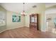 Dining area featuring new wood floors, designer chandelier, and built in hutch at 507 Ventura Ct, The Villages, FL 32159
