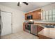 Efficient kitchen design featuring wood cabinetry, stainless appliances, and ample storage at 507 Ventura Ct, The Villages, FL 32159