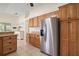 A spacious kitchen featuring stainless steel appliances and wooden cabinetry at 507 Ventura Ct, The Villages, FL 32159