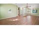Bright and airy living room features new wood floors, vaulted ceilings, and an open floor plan at 507 Ventura Ct, The Villages, FL 32159