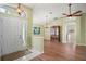 Inviting living area features new wood floors, vaulted ceiling and plentiful natural light at 507 Ventura Ct, The Villages, FL 32159