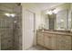 Nicely remodeled bathroom featuring a walk-in shower and granite countertops at 507 Ventura Ct, The Villages, FL 32159