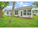 A beautiful rear view of the home with lots of windows and doors at 507 Ventura Ct, The Villages, FL 32159