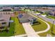 Aerial view of a single Gathering home with solar panels in residential neighborhood at 5354 Travertine St, Mount Dora, FL 32757