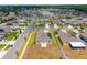 An aerial view of a residential neighborhood featuring single-Gathering homes with well-maintained lawns and landscaping at 5354 Travertine St, Mount Dora, FL 32757