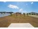 A spacious backyard with a patio and mature landscaping, ideal for outdoor activities and relaxation at 5354 Travertine St, Mount Dora, FL 32757