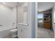Bright bathroom with a tub-shower, vanity, and a view into the office at 5354 Travertine St, Mount Dora, FL 32757