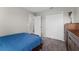 Comfortable bedroom with dark-wood furniture and bright white closet doors at 5354 Travertine St, Mount Dora, FL 32757