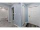 Welcoming entryway with tile flooring, a coat closet, and a view into the bathroom, creating a functional and inviting space at 5354 Travertine St, Mount Dora, FL 32757