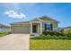 Charming one-story home with a well-maintained lawn and inviting front porch at 5354 Travertine St, Mount Dora, FL 32757