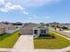 Charming single-story home with a well-maintained lawn and landscaped garden at 5354 Travertine St, Mount Dora, FL 32757