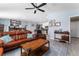 Bright living room with tile flooring and open access to the kitchen at 5354 Travertine St, Mount Dora, FL 32757