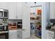 Walk-in pantry with ample shelving for organized food storage at 5354 Travertine St, Mount Dora, FL 32757