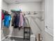 Well-organized walk-in closet with wire shelving, ample hanging space, and neutral colors, maximizing storage solutions at 5354 Travertine St, Mount Dora, FL 32757