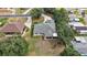Aerial view of the home showcasing its landscaping and surrounding neighborhood at 562 Dowling Cir, Lady Lake, FL 32159