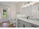Tastefully updated bathroom with marble vanity and walk-in shower at 562 Dowling Cir, Lady Lake, FL 32159