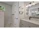 Well-lit bathroom featuring stylish light fixture and marble vanity top at 562 Dowling Cir, Lady Lake, FL 32159