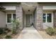 Welcoming front entryway featuring stone accents, a modern door, and manicured landscaping at 562 Dowling Cir, Lady Lake, FL 32159