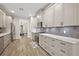 Stylish kitchen features stainless steel appliances, marble countertops, ample cabinet space, and wood flooring at 562 Dowling Cir, Lady Lake, FL 32159
