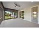 Spacious screened-in lanai, perfect for outdoor relaxation and entertaining, with views of the manicured backyard at 562 Dowling Cir, Lady Lake, FL 32159