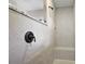 Walk-in shower featuring beautiful tilework and bronze fixtures at 562 Dowling Cir, Lady Lake, FL 32159