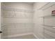 Walk-in closet featuring wire shelving for optimal storage and organization of clothes and personal items at 562 Dowling Cir, Lady Lake, FL 32159